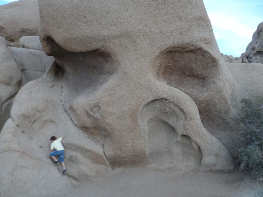 boy climbing skull rock 